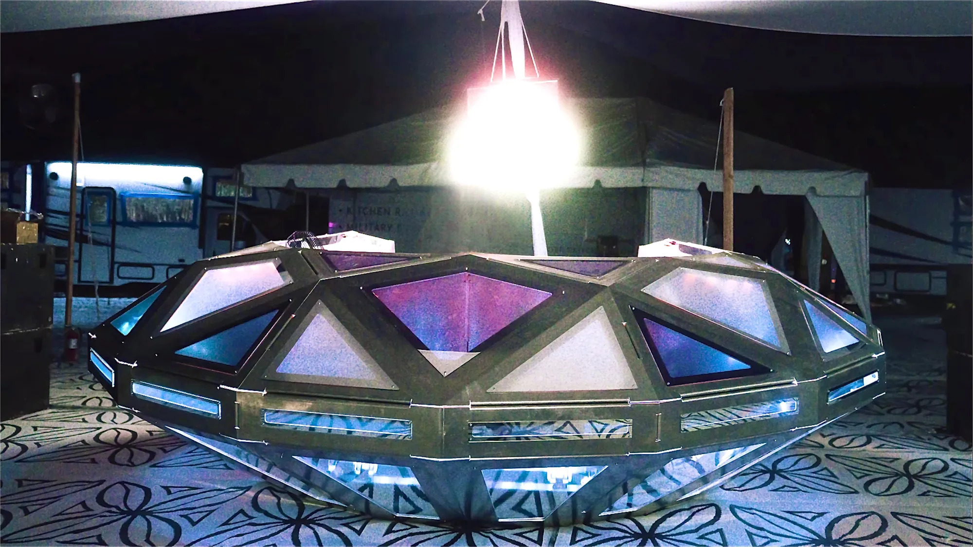 Diamond UFO — A festival console nearly four metres across — folded aluminium under mirror steel, lit through frosted PMMA.