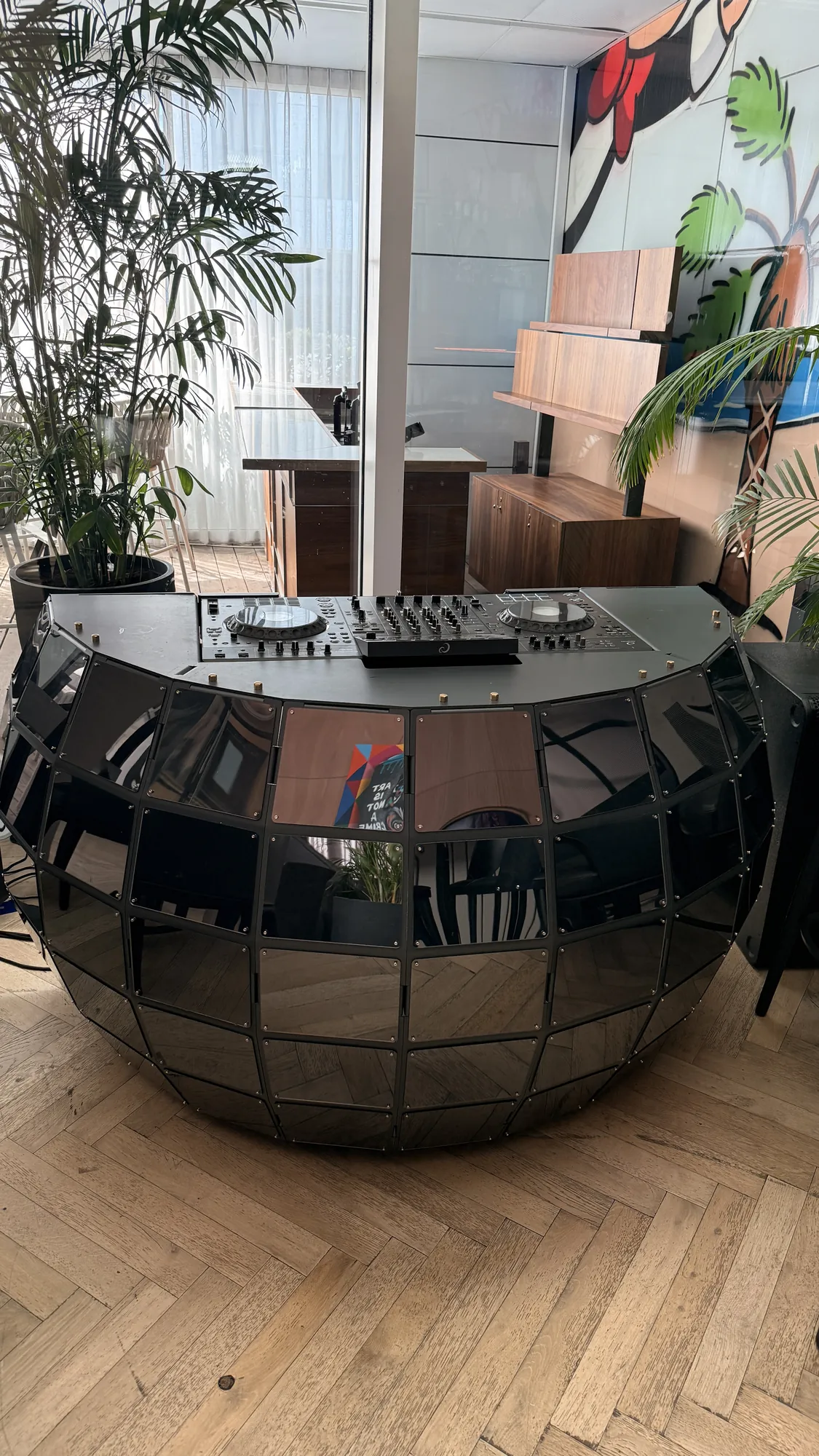 Quad Sphere — A planet of panels around the DJ — sheet metal closing into a sphere.